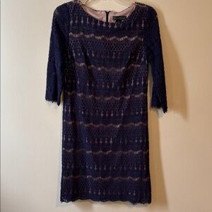 Navy open weave a-line dress with cream lining. Fringe details on sleeves/hem.